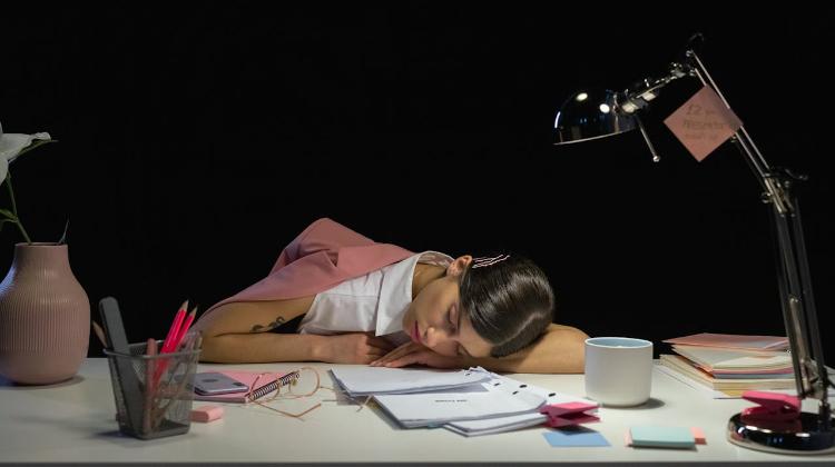 Woman sleeping on desk
