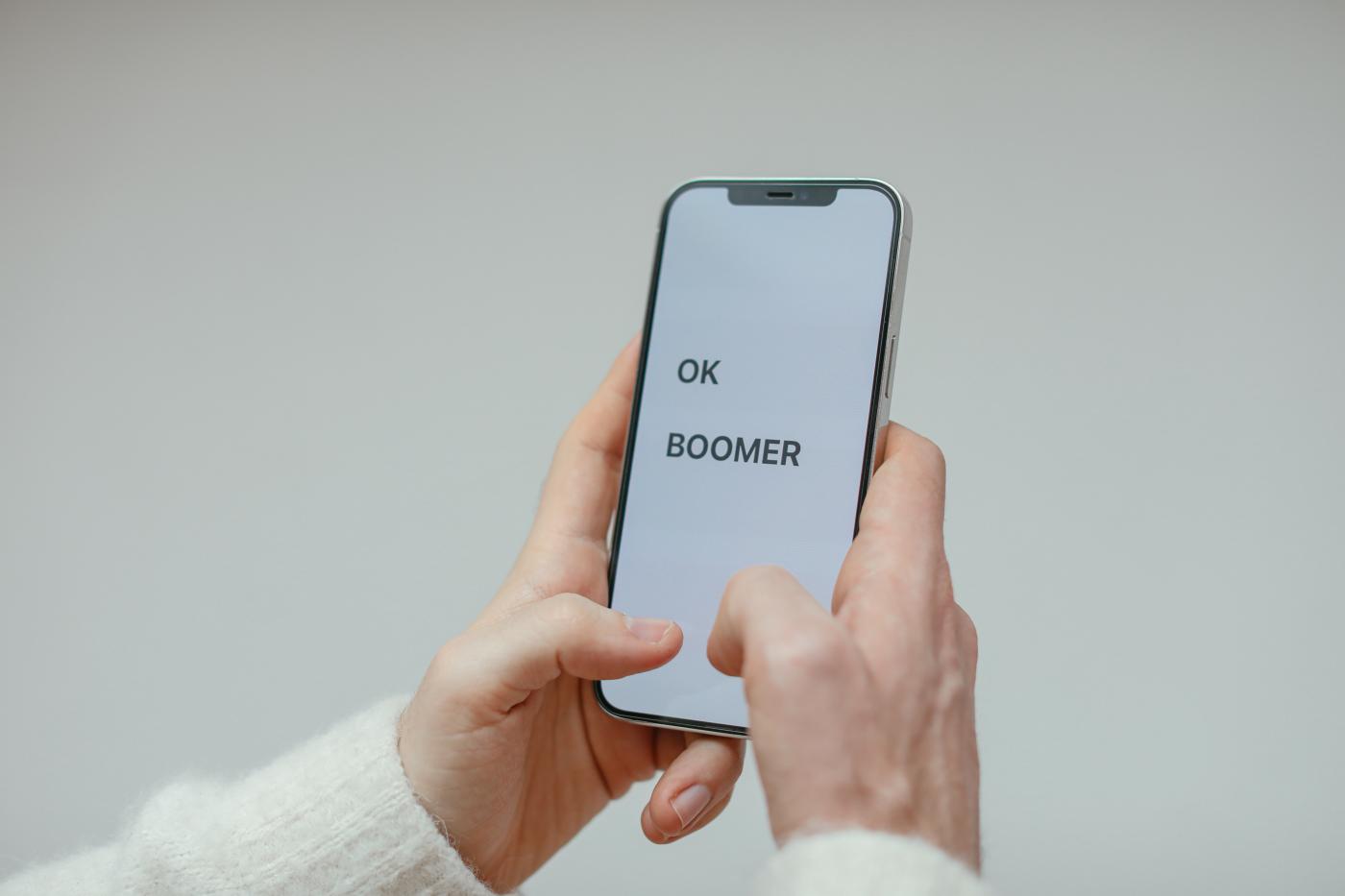 Phone screen with the words "OK boomer"