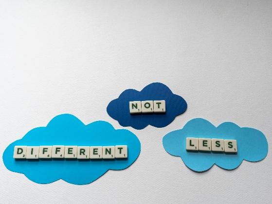 Image of three blue clouds with the text "not less different".