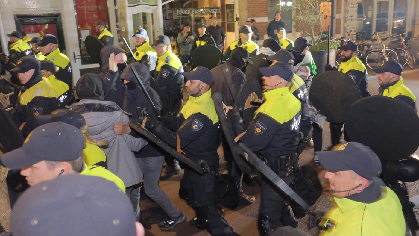 Violence by riot police May 7 Photo:James Huang