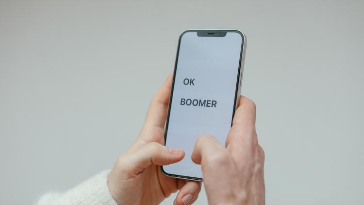 Phone screen with the words "OK boomer"